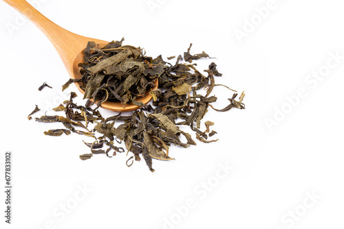 Dried green tea on the whit...