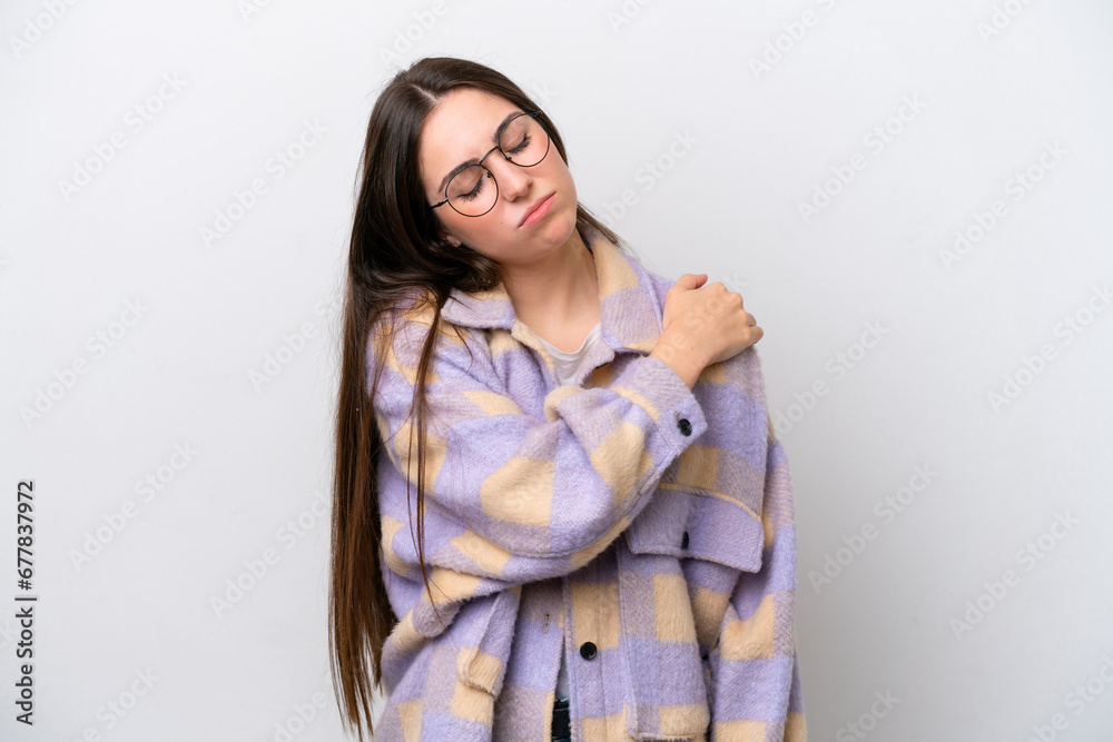 Young girl isolated on white background suffering from pain in shoulder for having made an effort Young girl isolated on white background suffering from pain in shoulder for having made an effort