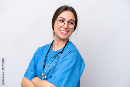 surgeon doctor woman holding tools isolated on white background with arms crossed and happy © luismolinero