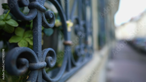 European Sidewalk Framed by Elegant Window Security metal gate demarcating property protection photo