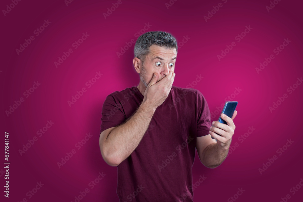 Confused afraid man using mobile phone. Emotion concept Confused afraid man using mobile phone. Emotion concept