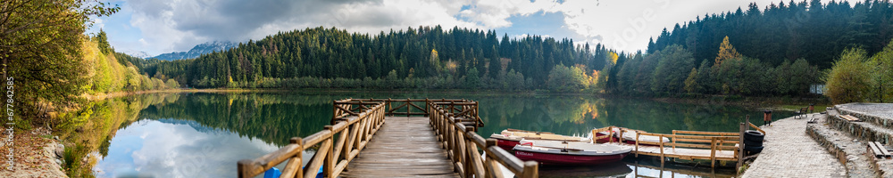 A magnificent lake with its reflection on the surrounding forest and lake panaroma
