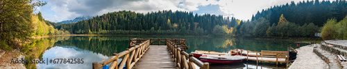 A magnificent lake with its reflection on the surrounding forest and lake panaroma photo