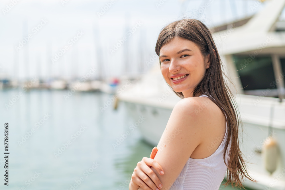 Young pretty woman at outdoors With happy expression Young pretty woman at outdoors With happy expression
