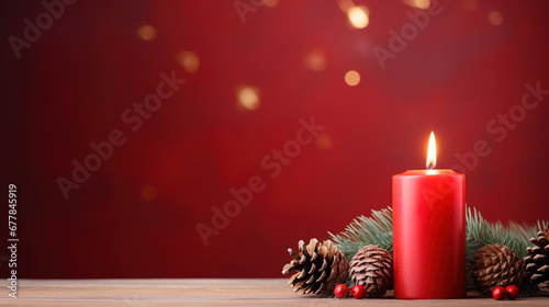 Christmas - Banner Of 1 candle and xmas ornament, Pine-cones And green Spruce Branches minimal red background and lights in the back, with empty copy space © Uwe
