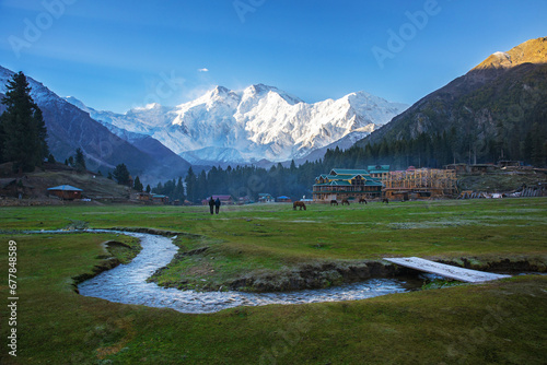 Nanga Parbat view with the stream at Fairy Meadows. and horses graze on the meadow. The world's ninth highest mountain towering above idyllic alpine scenery in Northern Pakistan. Kharakorum highway photo