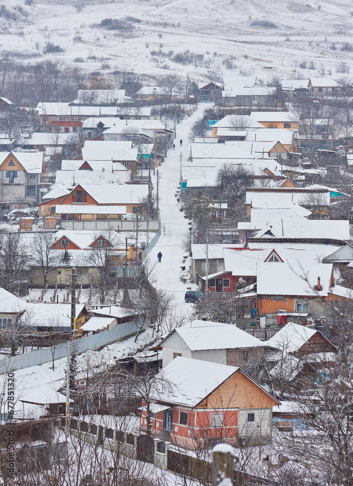 winter landscape with country houses covered with snow
