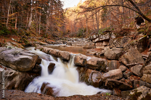 Obraz na płótnie autumn landscape with mountain river and silky waterfall w salonie