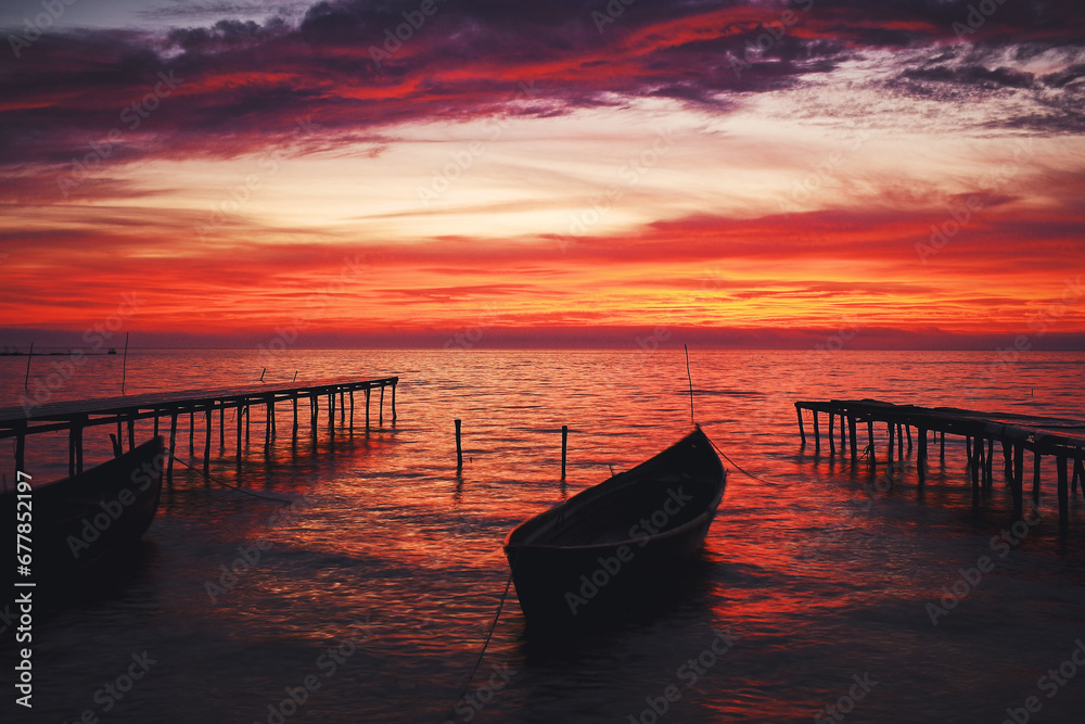 boat at sunrise on the lake