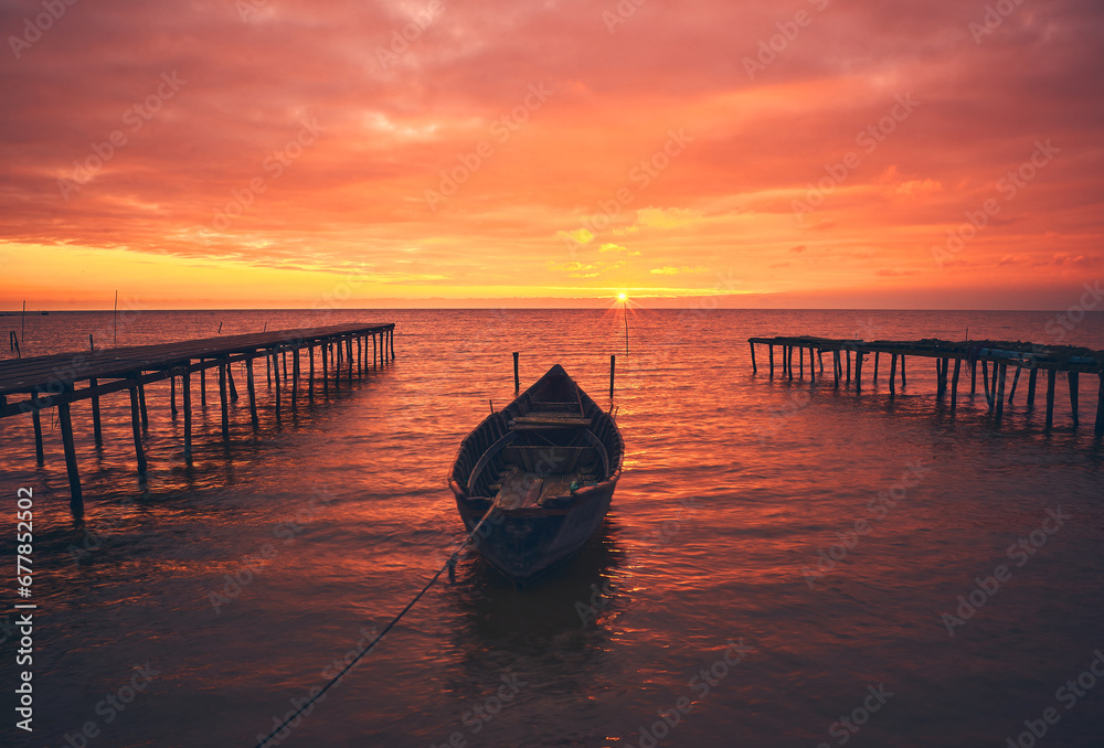 boat at sunrise on the lake