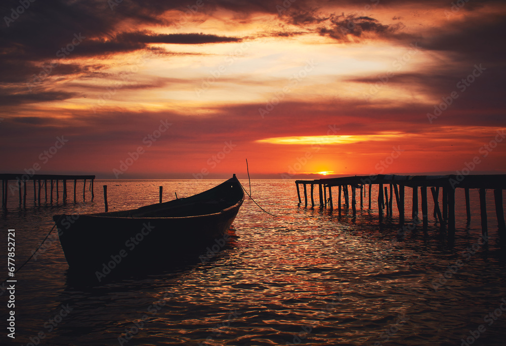 boat at sunrise on the lake