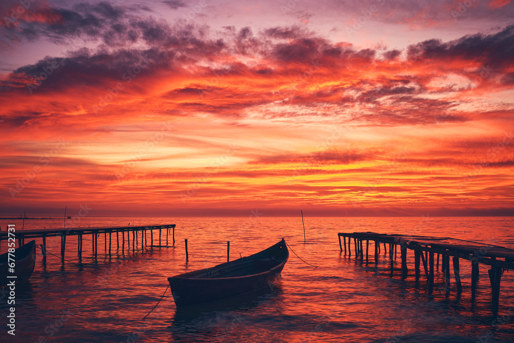 boat at sunrise on the lake