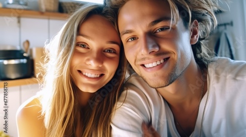 A happy young european couple together on the kitchen. Cozy home and love concept