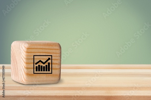 Continuous improvement concept. wood cube with icon