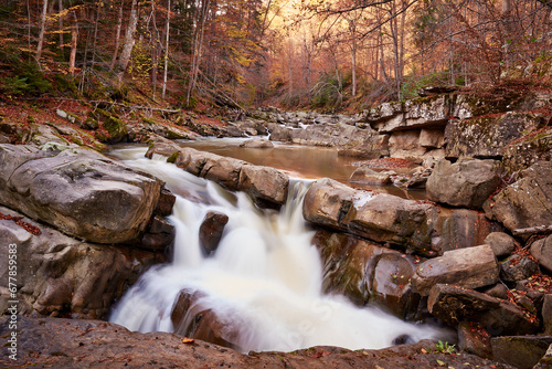 Obraz na płótnie autumn landscape with mountain river and silky waterfall w salonie