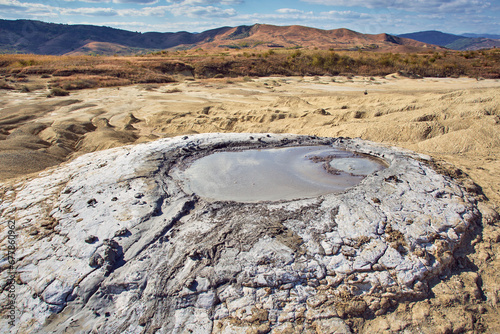 Obraz na płótnie cones of mud volcanoes from which rivers of mud flow w salonie