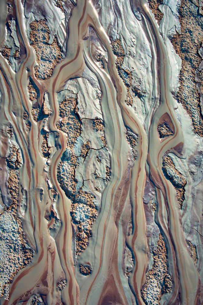 cones of mud volcanoes from which rivers of mud flow