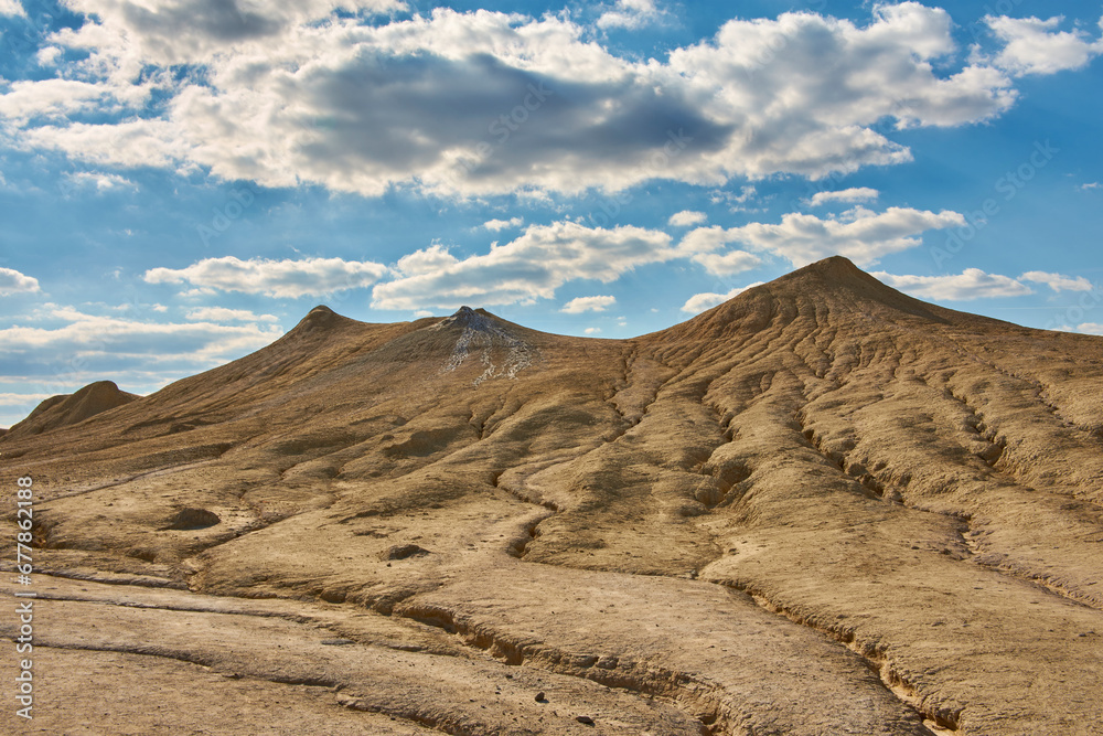 cones of mud volcanoes from which rivers of mud flow