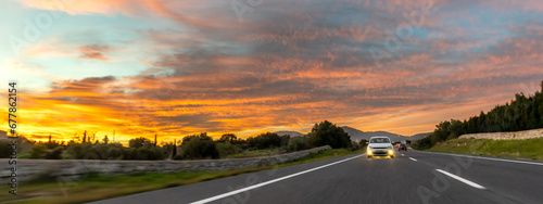 Obraz na płótnie rental car in spain mountain landscape road at sunset w salonie