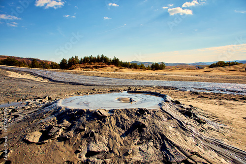 Obraz na płótnie cones of mud volcanoes from which rivers of mud flow w salonie