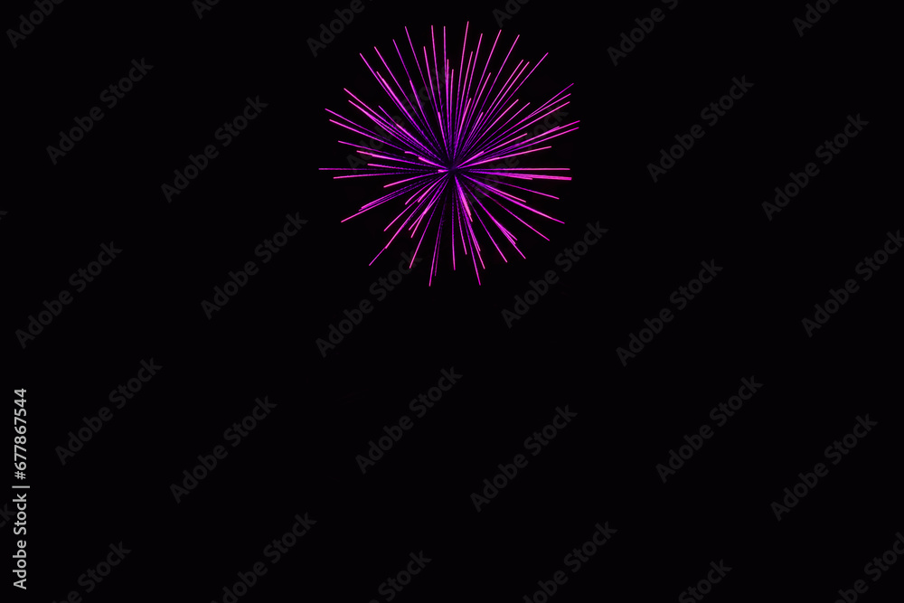 New Year's Night, Diwali, bonfire night Colourful Starbursts and Rocket Explosions on Black Background Sky with Red, Green, Blue, Purple, Gold Colour Fireworks Bursts with Space for Text-Smoke-free