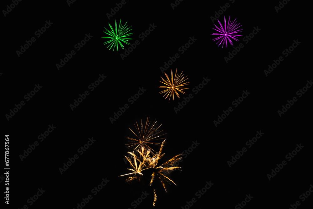 New Year's Night, Diwali, bonfire night Colourful Starbursts and Rocket Explosions on Black Background Sky with Red, Green, Blue, Purple, Gold Colour Fireworks Bursts with Space for Text-Smoke-free New Year's Night, Diwali, bonfire night Colourful Starbursts and Rocket Explosions on Black Background Sky with Red, Green, Blue, Purple, Gold Colour Fireworks Bursts with Space for Text-Smoke-free