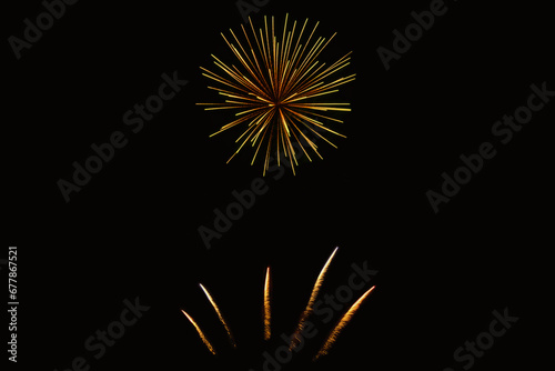 New Year\'s Night, Diwali, bonfire night Colourful Starbursts and Rocket Explosions on Black Background Sky with Red, Green, Blue, Purple, Gold Colour Fireworks Bursts with Space for Text-Smoke-free