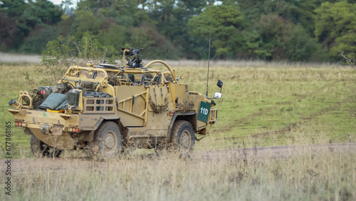 British army Supacat Jackal 4x4 rapid assault, fire support and reconnaissance vehicle in action on a military exercise, Wilts UK