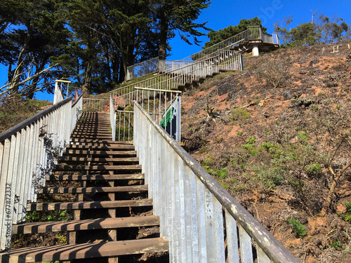 View from below of a stairway that leads up to a sightseeing platform in San Francisco, California on a sunny fall day.