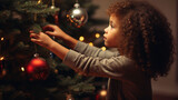 A cute girl decorates a Christmas tree
