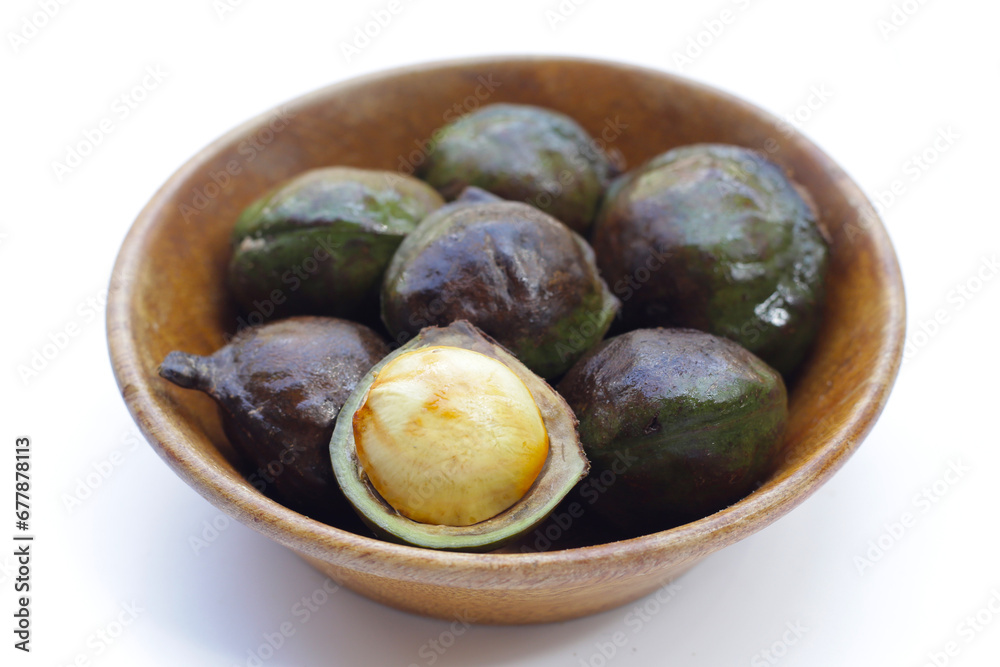 Djenkol fruit bean in wooden bowl Djenkol fruit bean in wooden bowl