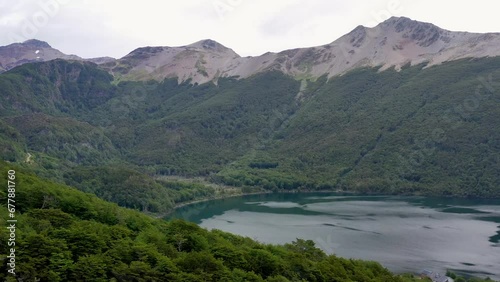 Wallpaper Mural Drone flying through trees on the mountains of Tierra del Fuego National Park, in Ushuaia, Argentina. The Beagle Channel enters the mountain range on fjords  Torontodigital.ca