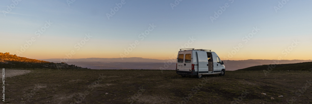 Panorama of Serra da Arada over mountain landscape at evening sunset with camper van on road trip, Sao Pedro do Sul, Portugal