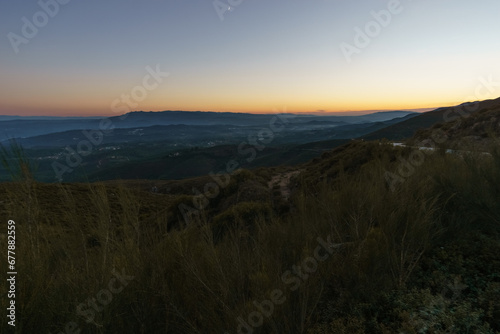 View from Serra da Arada over mountain landscape at evening twilight with crescent moon  Sao Pedro do Sul  Portugal