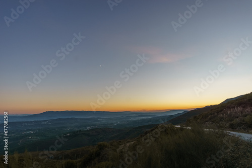 View from Serra da Arada over mountain landscape at evening twilight with crescent moon, Sao Pedro do Sul, Portugal