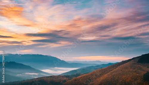 autumn sunrise cloudy sky over mountains abstract colorful peaceful sky background