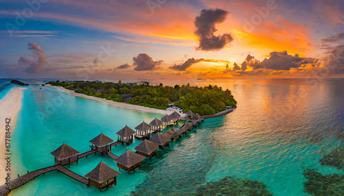 aerial sunset of beautiful maldives paradise tropical beach amazing colorful sea sky bay water palm trees sandy beach luxury villas resort travel vacation destination best popular landscape view