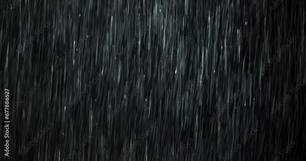 A heavy rain wall falls in front of the black screen in 4K loopable high-speed footage. Raindrops splashing. Rain closeup VFX insert. Practical, seamlessly loopable. Heavy rainstorm hitting black.