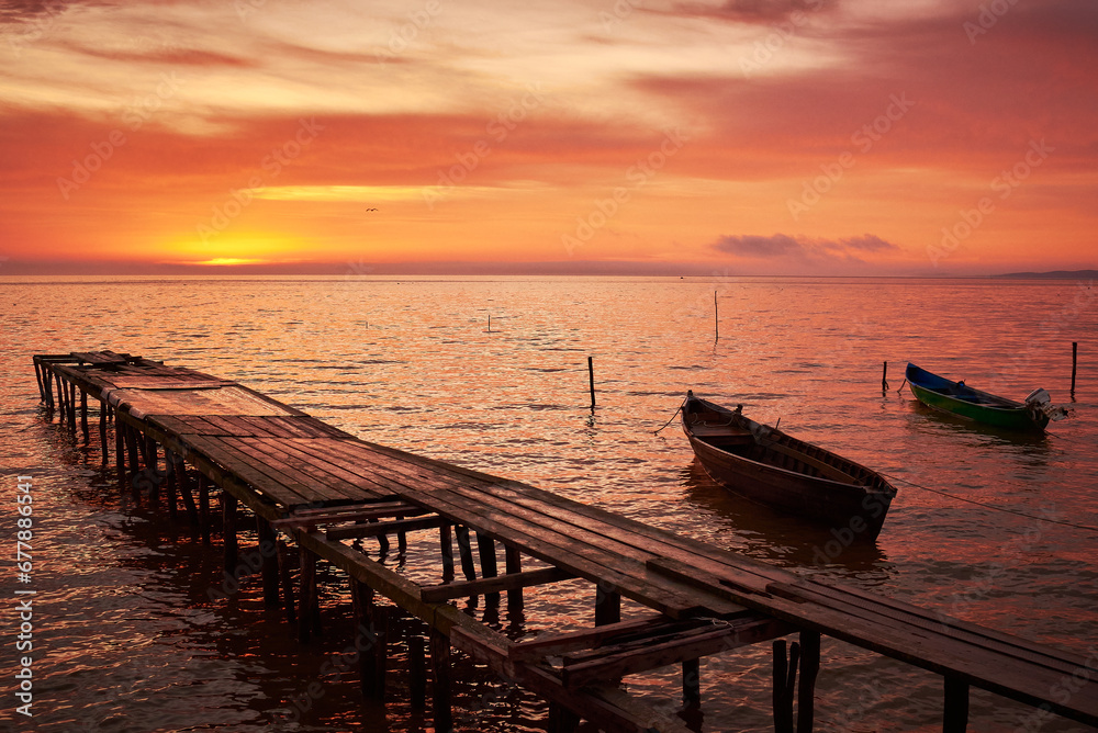 boat at sunrise on the lake