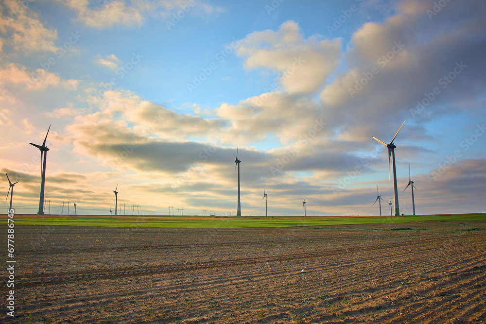 wind farm at sunrise in Romania