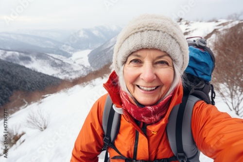 Traveler influencer taking selfie during travel in winter season backpack on alps mountain comeliness