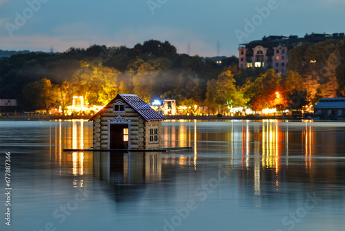 Floating wooden hut on a lake, Valea Morilor Park (Parcul Valea Morilor) at night, Chisinau, Moldova photo