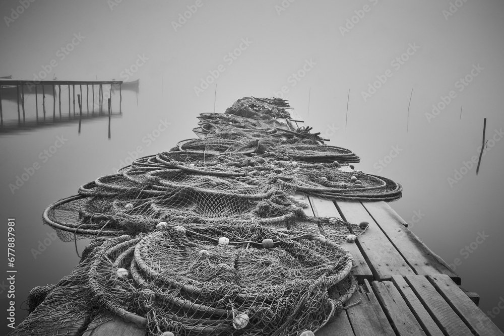 fishing nets on the shore of the lake