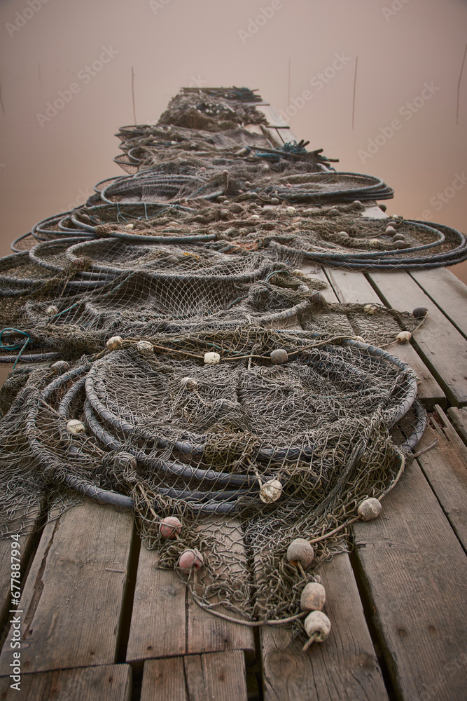 fishing nets on the shore of the lake