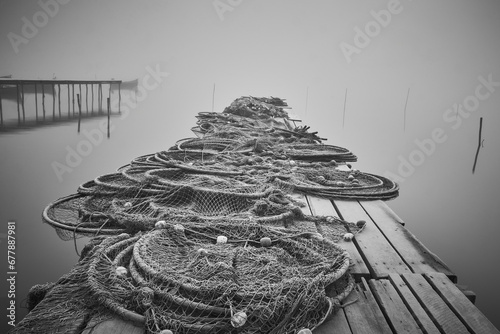 Obraz na płótnie fishing nets on the shore of the lake w salonie
