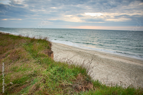 sunrise on the shore of the black sea © Marius Burcea