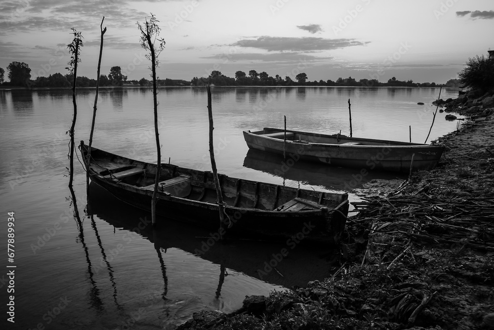sunrise with boats on the lake