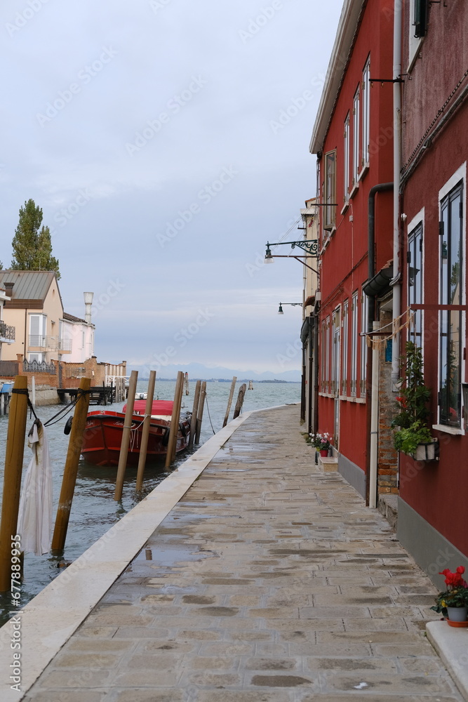 A view of the small canal of Murano. Venice, Italy - November 12, 2023.
