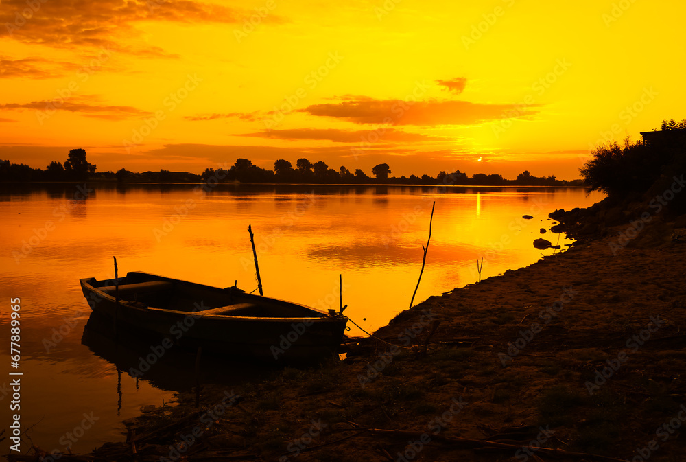 sunrise with boats on the lake