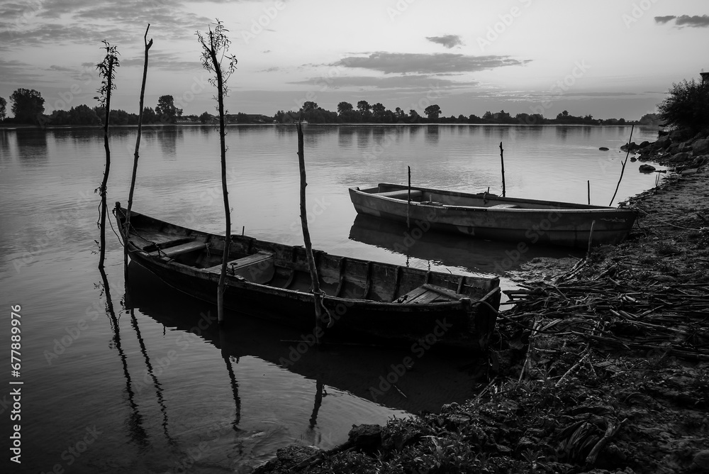 sunrise with boats on the lake